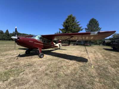 Aeronca Sedan 15AC N1182H Tied Down at grass field called StarGazer